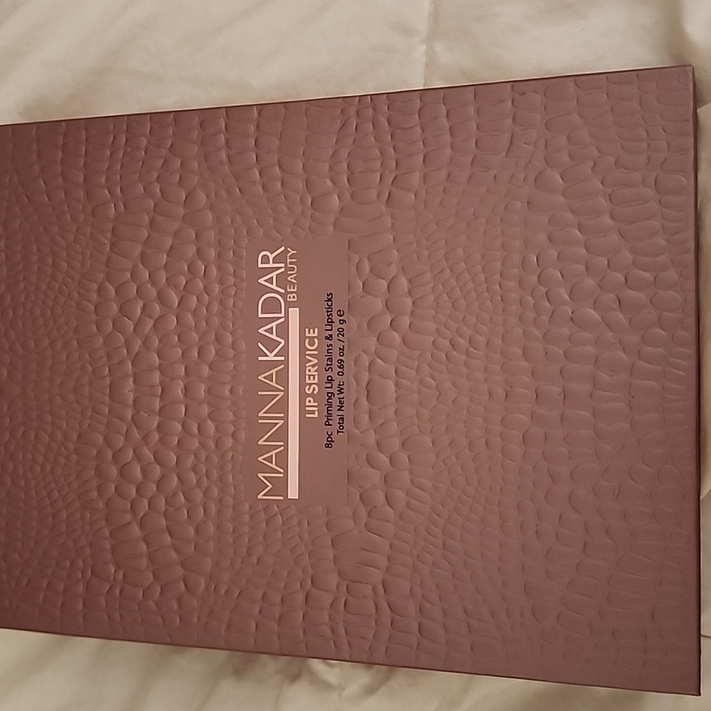 Manna Kadar Lip Service in Textured Brown Packaging